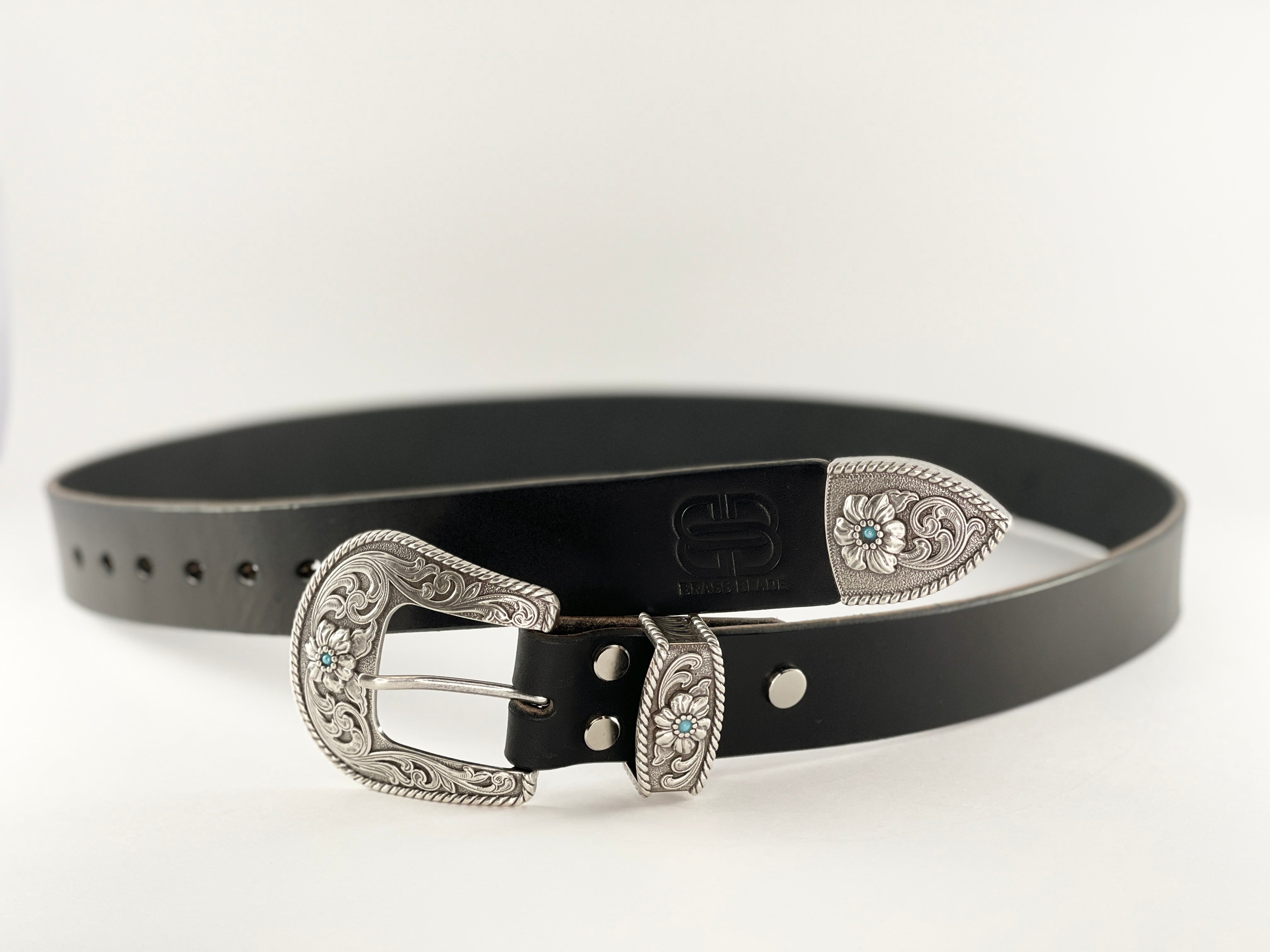 Black belt with silver buckle on a white background