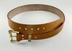 Brown leather belt with brass buckle on a white background