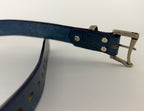 Blue leather belt with silver buckle on a white background