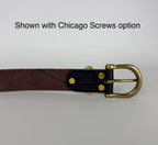 Close up picture of the back of a brown leather belt showing a brass buckle and keeper secured with Chicago screws. There's a caption that says "Shown with Chicago Screws option" at the top of the screen.