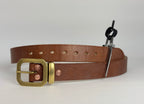 Brown leather belt with brass buckle, keeper and copper rivets on a white background
