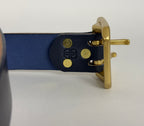 Close-up of the back of a Navy blue leather belt with brass buckle on a white background.  The brass rivets are being highlighted.