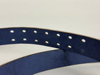 Close-up of a Navy blue belt showing double-pronged belt holes on a white background 