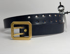 Front view of a Navy leather belt with a brass buckle on a light gray background