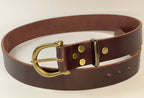 Brown leather belt with brass buckle on a white background