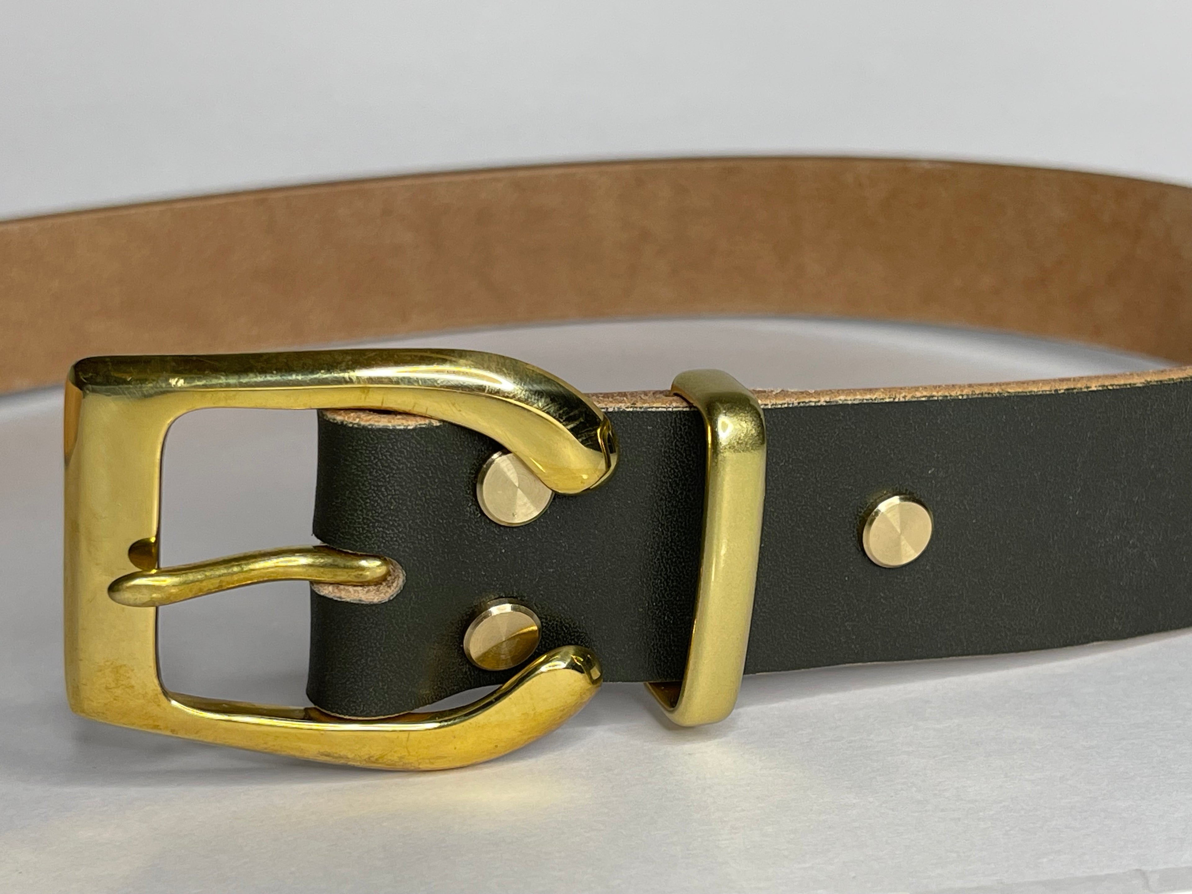 Dark green leather belt with gold buckle on a white background