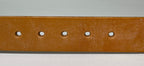 Brown leather belt with five holes on a gray background
