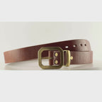 Video of a dark brown leather belt with an octagonal brass buckle on a carousel